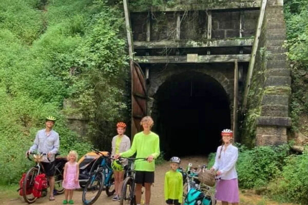 Cyclists at one of the historic tunnels on the Elroy-Sparta State Trail near Sparta Wisconsin