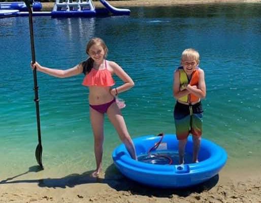 Kids playing at the beach during a birthday party at Whiskey Creek Family RV Park in Sparta Wisconsin